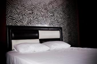 Bedroom with swirled zebra print wallpaper