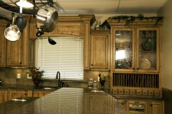 Wooden kitchen cabinets with seeded glass doors