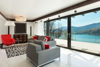 Sliding glass doors on wall with sheer treatment