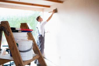 Man painting garage interior