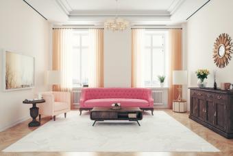 Art deco style living room with pink sofa and armchair