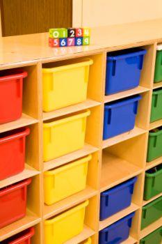 Bins help keep playrooms organized.