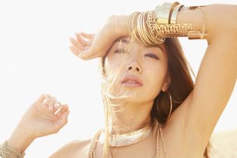 Woman wearing gold bracelets