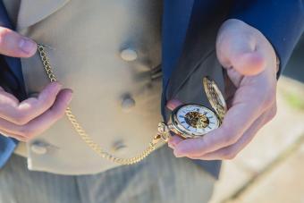 Man Holding Pocket Watch