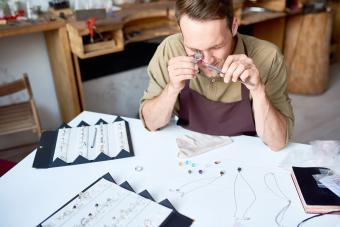 Man Appraising Jewelry in Shop