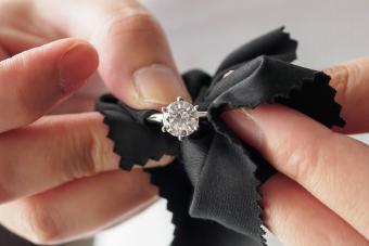 cleaning a cubic zirconia ring with a cloth