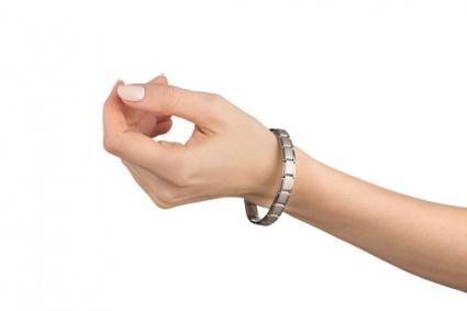 Woman hand with magnetic bracelet