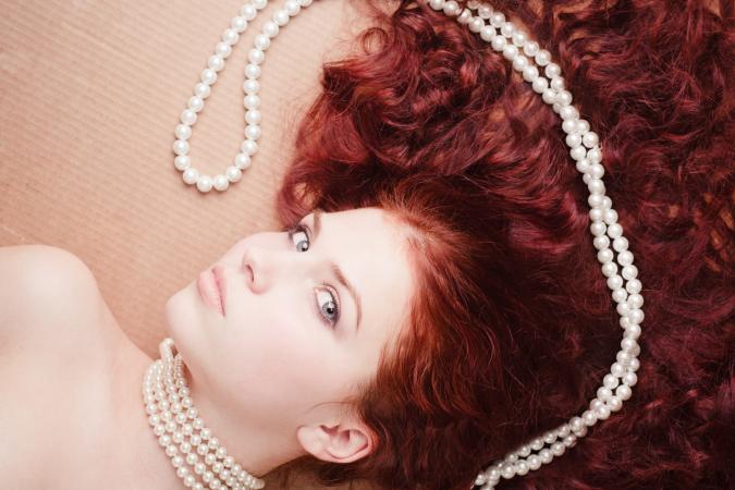 redhead with pearls