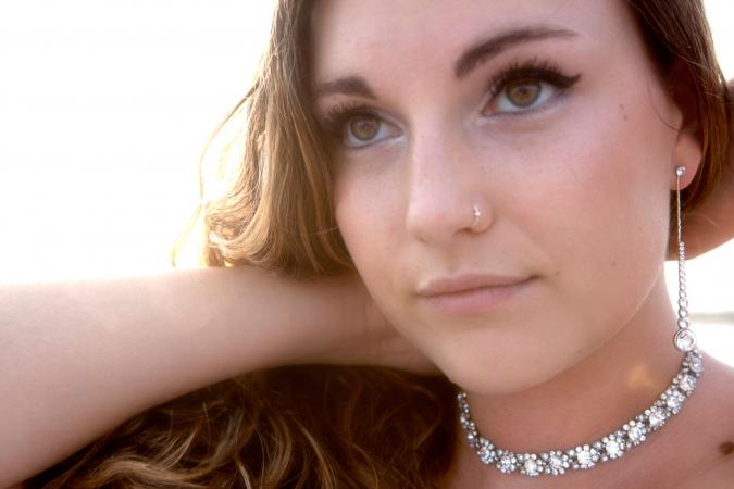 Woman wearing rhinestone necklace and earrings