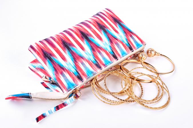 isolated jewelry bag with gold bangles