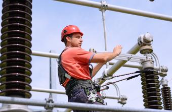 electrician working on electric pylon