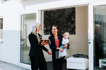Real Estate agent showing woman house