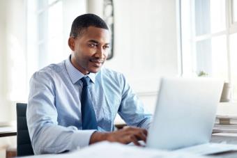 businessman writing LinkedIn recommendation