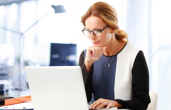 Public relations writer working on laptop