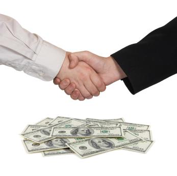 Hands shaking over grant money