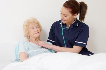 nurse listening to patient's heart