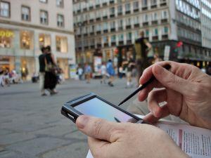 Travel writer making notes on his device