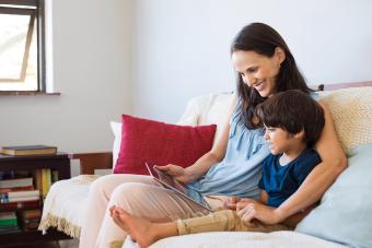 Mother and son using digital tablet