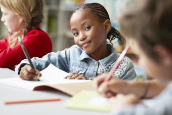 Kids writing in class