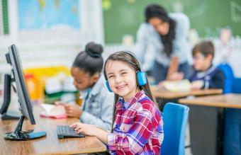 Happy Girl Using Computer