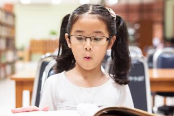 Student learning and reading book in library