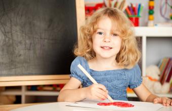 Girl painting heart