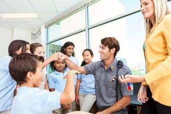 Policeman talking with students