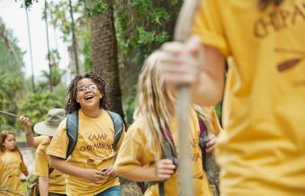 friends and camp counsellor in forest 