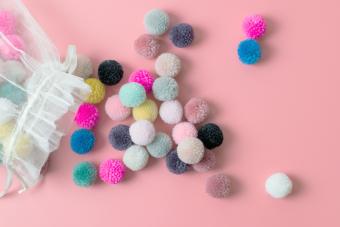 A bag of small colorful pompoms