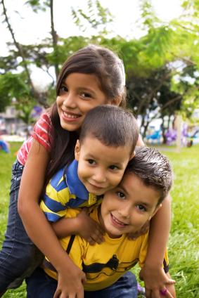 Siblings playing outdoors