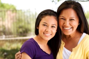 Pretty mother and daughter smiling