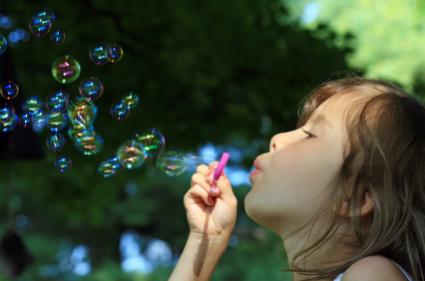preschooler blowing bubbles