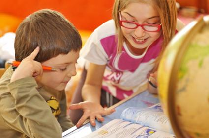 Kids working on an assignment; copyright Laurentiu Iordache at Dreamstime.com
