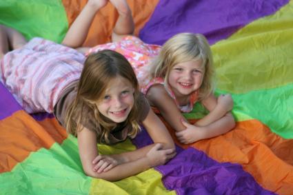Children on play parachute