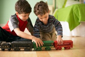 Boys sharing blocks