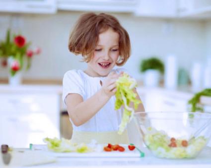 Little girl making meal