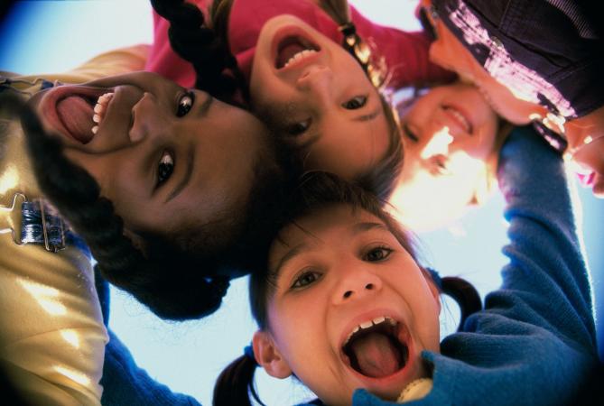 Children looking down at camera