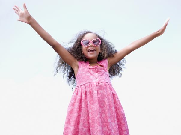 Happy, confident girl with arms outstretched