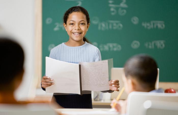 girl giving speech in school
