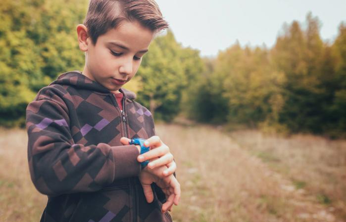 Boy checking the time