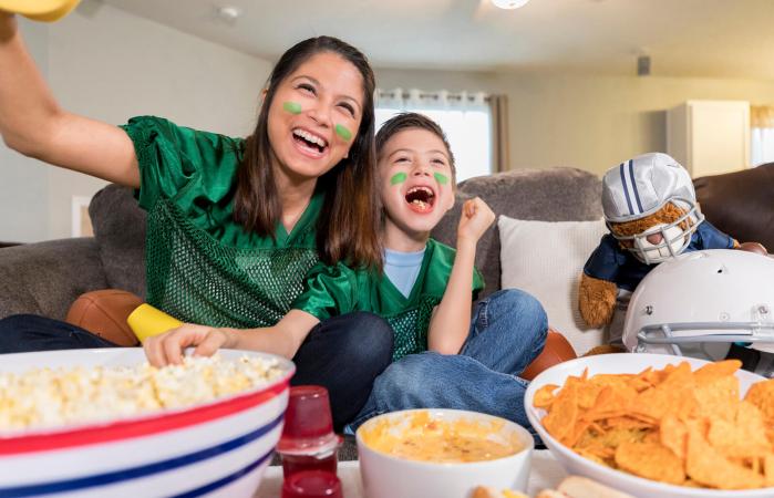 Mother and child watching the super bowl