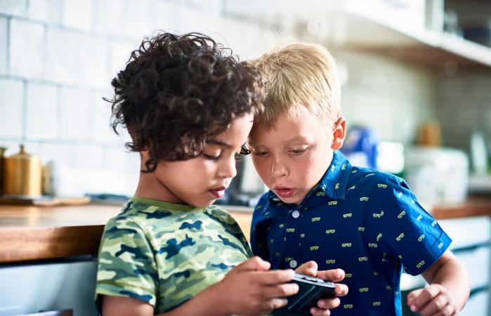 Boys playing video game