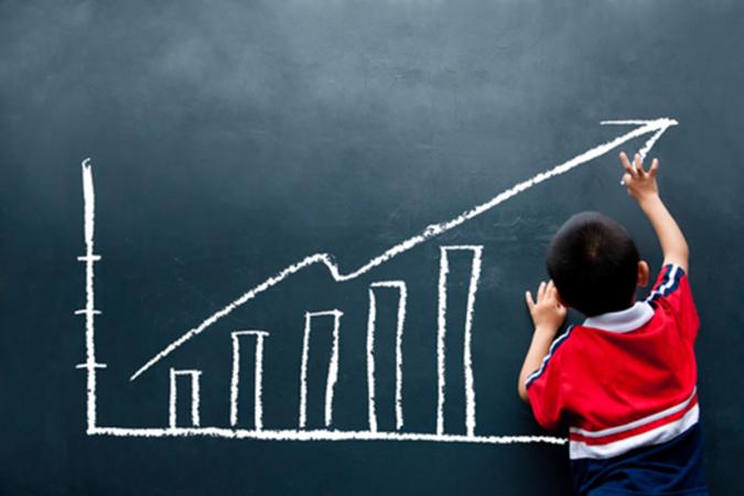 child drawing a chart