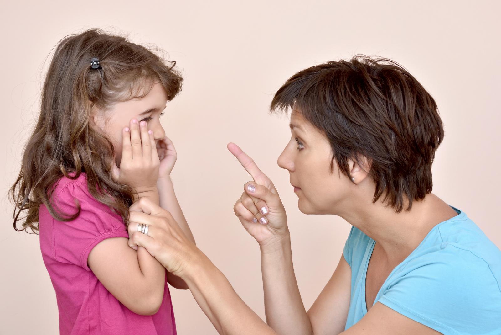 Mother scolding a daughter