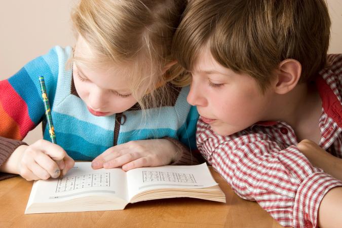 Girl and boy doing a puzzle