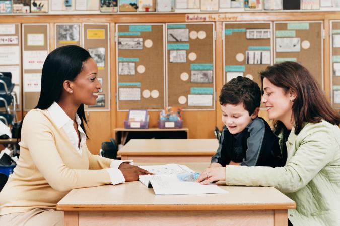 Teacher with parent and child