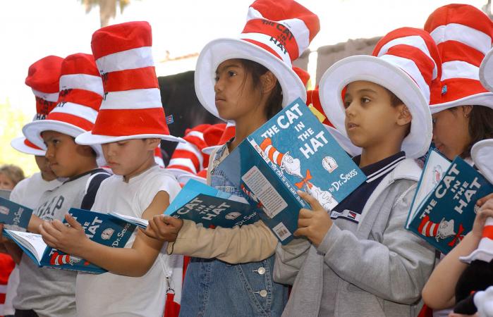 Children read from The Cat in the Hat book