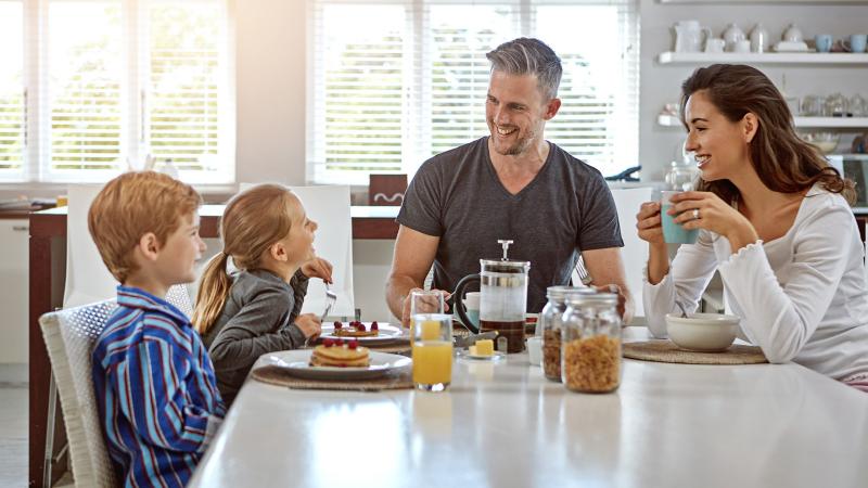 family having breakfast together and talking