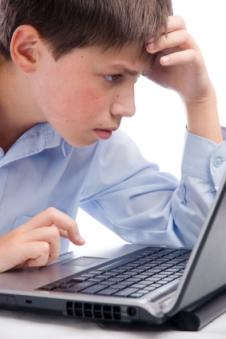 Special needs boy trying to play an online game