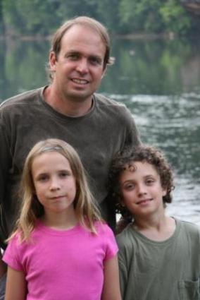 Dr. Rick Van Noy and children at the river